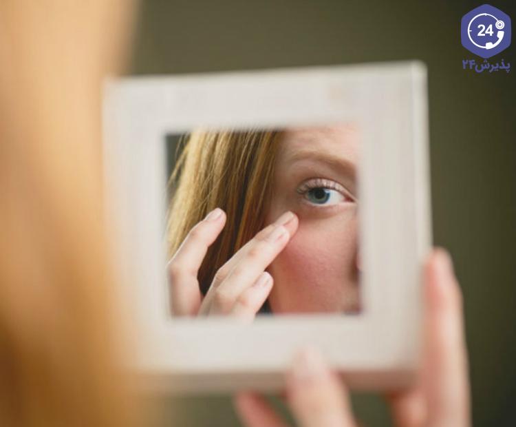 H:\نویسش\Woman-checking-under-eye-area-in-mirror_m.jpg